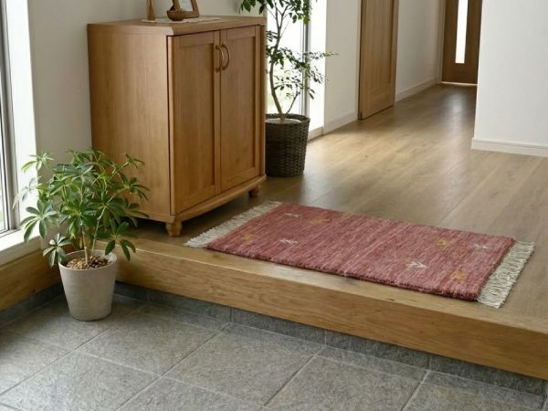 ギャッベのマットが敷かれた玄関